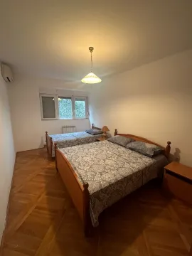 Bedroom with a large double bed and an additional single bed. - image 5