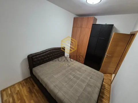 Bedroom with a double bed, wardrobes, and wooden flooring. - image 7