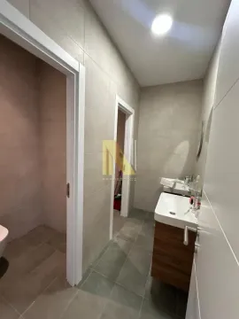 View of the bathroom with a sink and tiles. - image 15