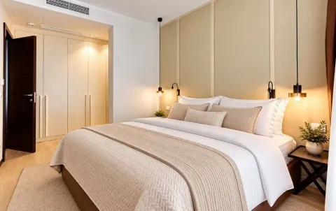 Comfortable bedroom with a double bed and a built-in wardrobe. - image 7