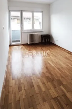 Empty room with hardwood floors and access to the terrace. - image 8