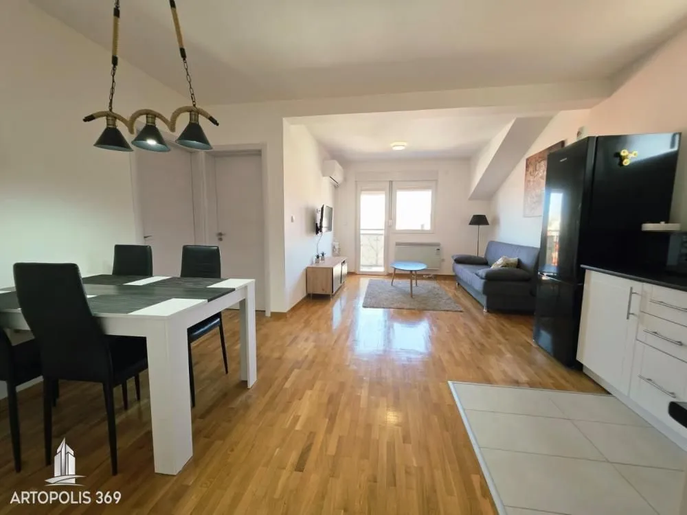 Living room connected with the dining area and kitchen.