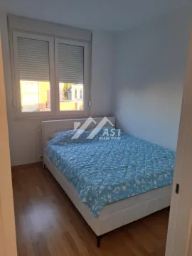 Bedroom with a double bed and a window. - image 5
