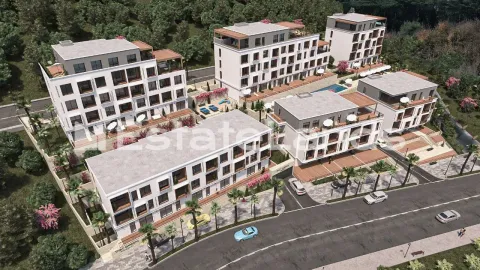 Prikaz 3D vizuelizacije stambenog kompleksa sa više zgrada i uređenim dvorištem. - image 6