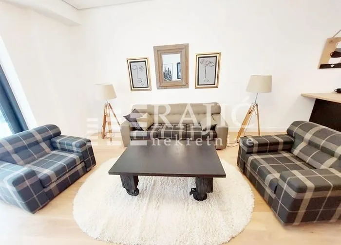 Spacious living room with a sofa set and a coffee table.