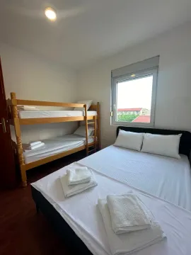 Bedroom with a double bed and a bunk bed. - image 5