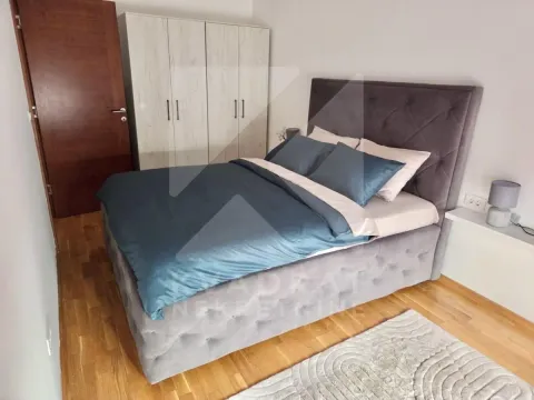 Bedroom with a double bed, wardrobe, and wooden flooring. - image 8