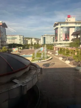 View from the window of the city square and surrounding buildings. - image 10