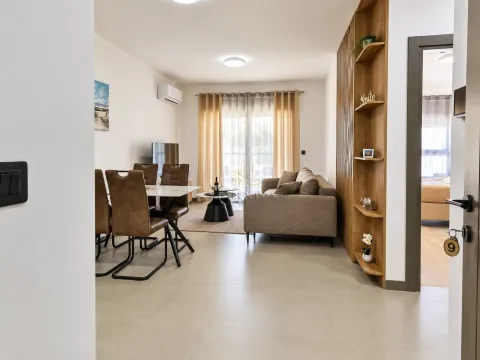 Living room with dining area and sofa. - image 3