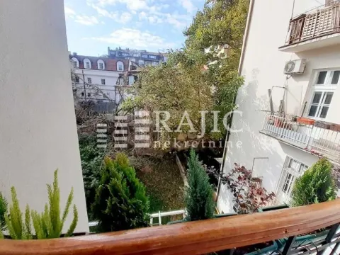 View from the terrace overlooking the courtyard and neighboring buildings. - image 13