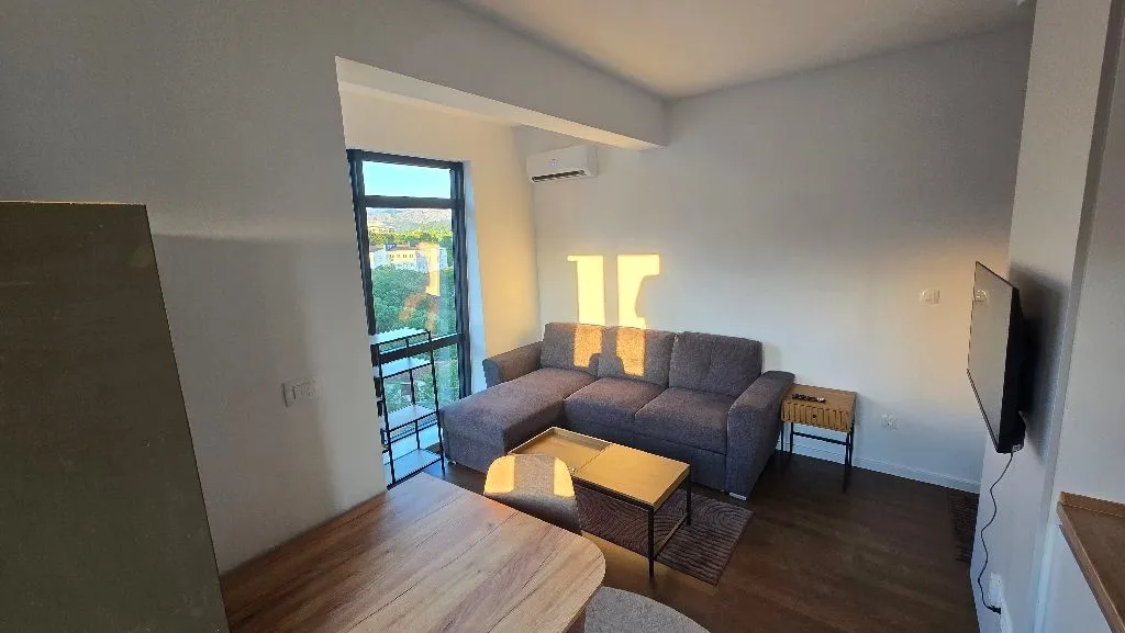Living room with a sofa set and a dining table.