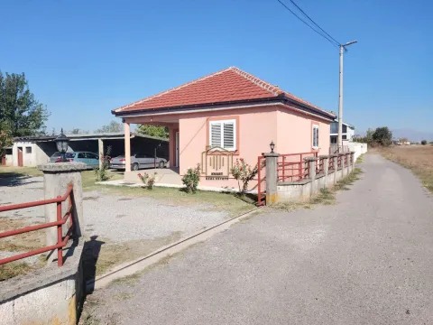 View of the exterior of the house with a courtyard and fence by the road. - image 9