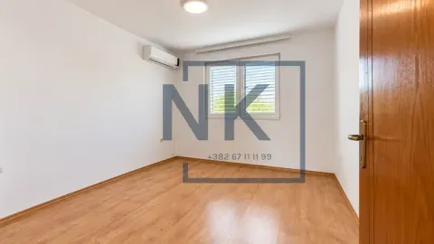 Empty room with white walls, laminate flooring, air conditioner and a window. - image 13