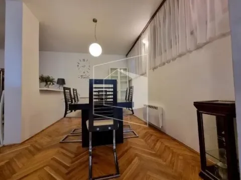 Dining room with a table and chairs in an apartment. - image 3