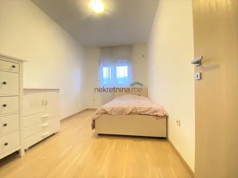 Furnished bedroom with a bed and a dresser. - image 9