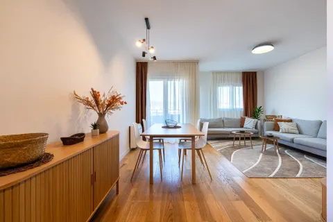 Spacious living room with a dining area and a sofa set. - image 4
