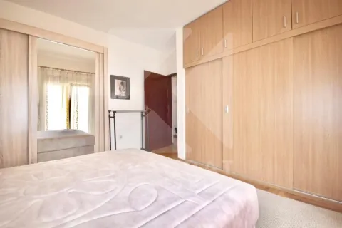 Bedroom with a double bed and a large built-in wardrobe. - image 8