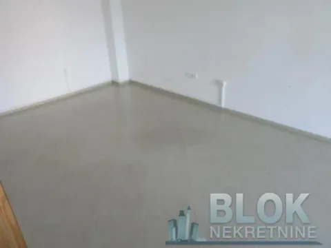 Empty room with white walls and tiled floor. - image 4
