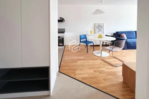 View of the living room with a dining area and part of the kitchen. - image 6