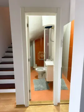 View from the hallway into a small bathroom with a shower enclosure. - image 16