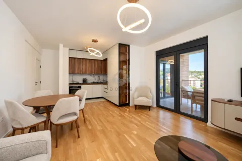 Spacious living room with a dining area and a modernly equipped kitchen. - image 4
