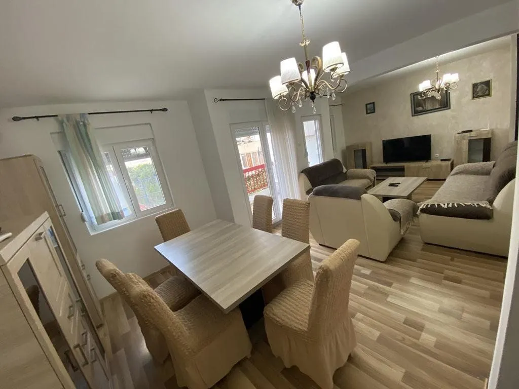 Living room with a dining area and seating furniture.