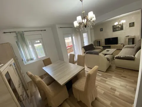 Living room with a dining area and seating furniture. - image 2