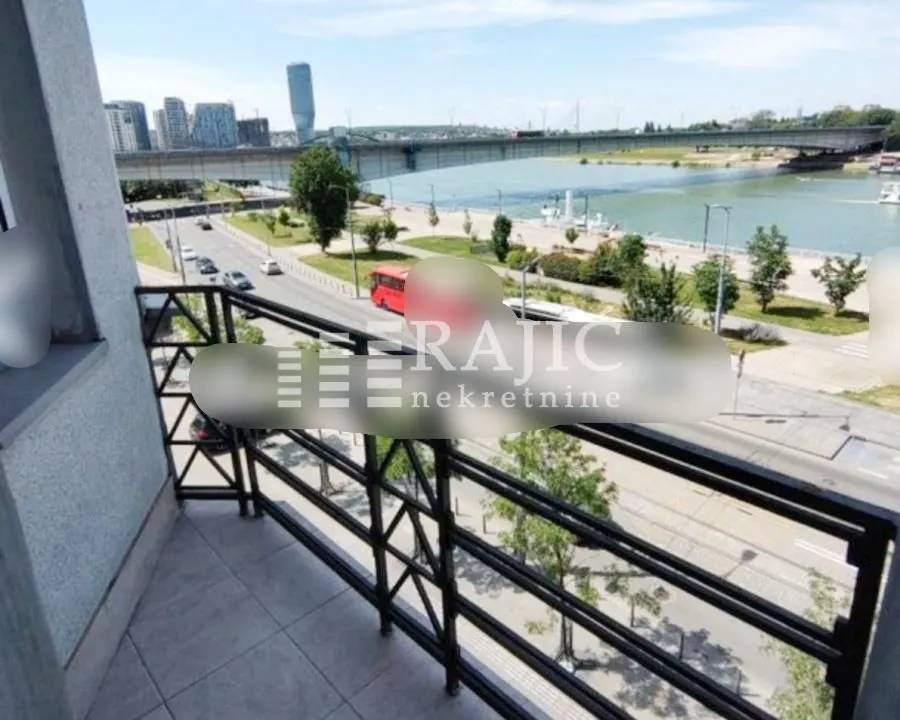 View from the balcony overlooking the river and city traffic.