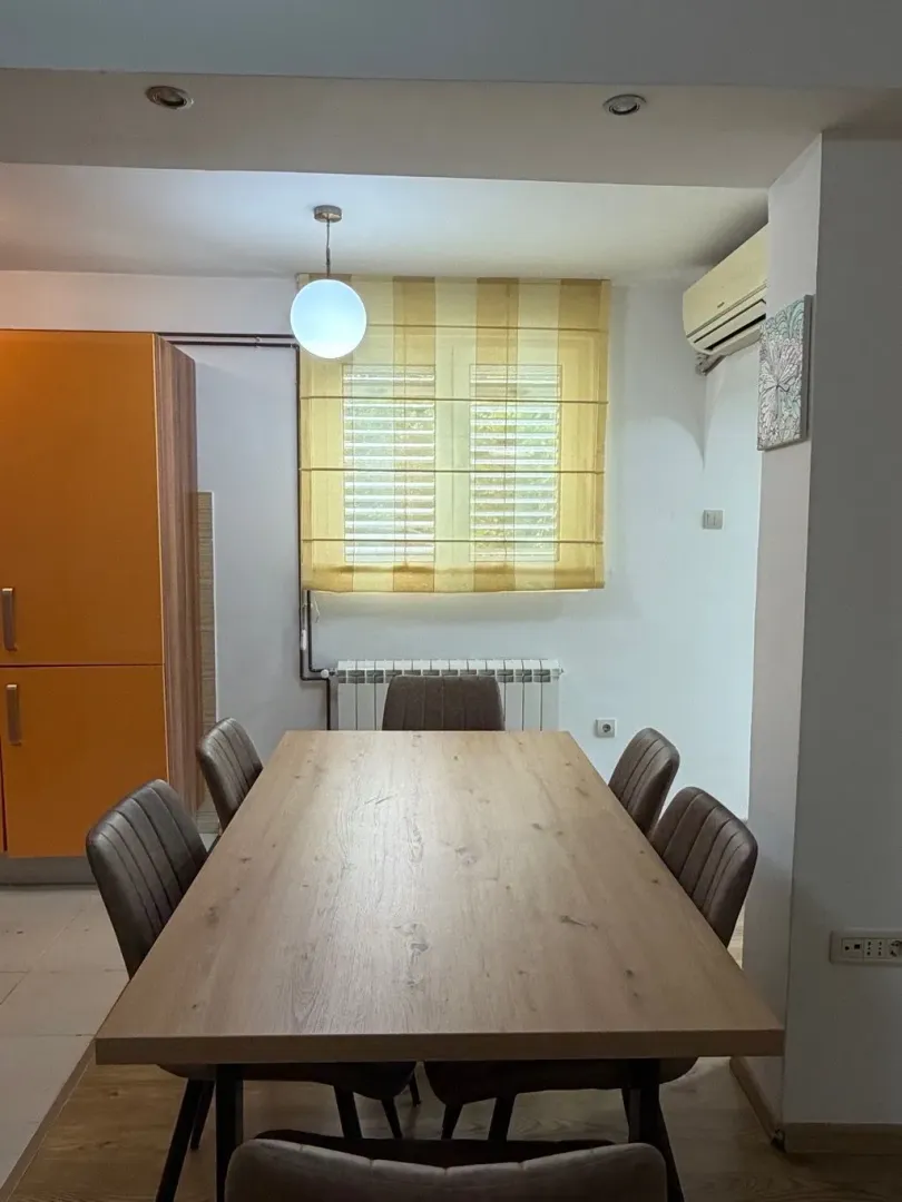 Dining area with a wooden table and chairs.