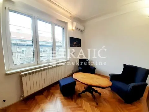 Living room with seating furniture and parquet flooring. - image 2