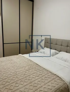 Furnished bedroom with a double bed and a fitted wardrobe. - image 6