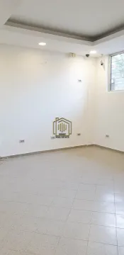 Empty bright room with tiled flooring and white walls. - image 7
