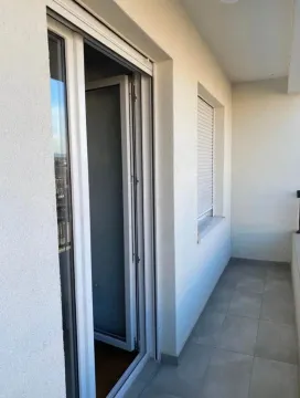 Unfurnished balcony space with ceramic tiles and balcony doors. - image 9