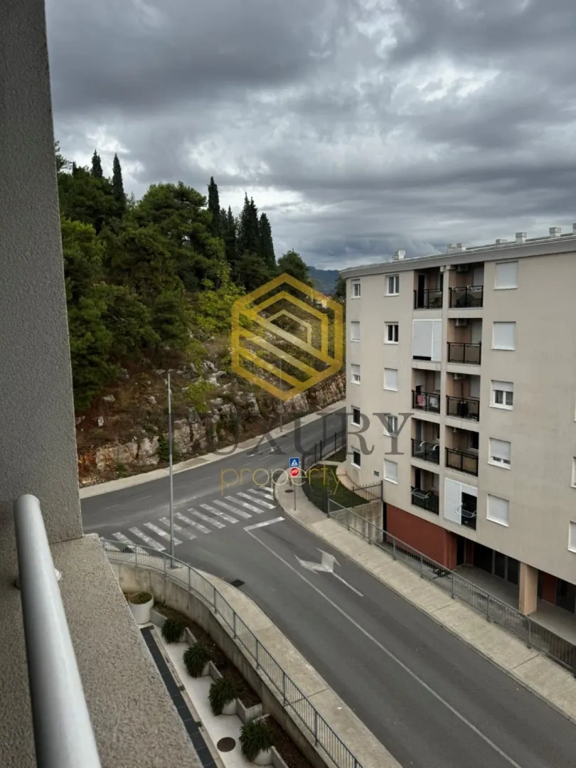 View from the terrace overlooking the street and neighbouring buildings.