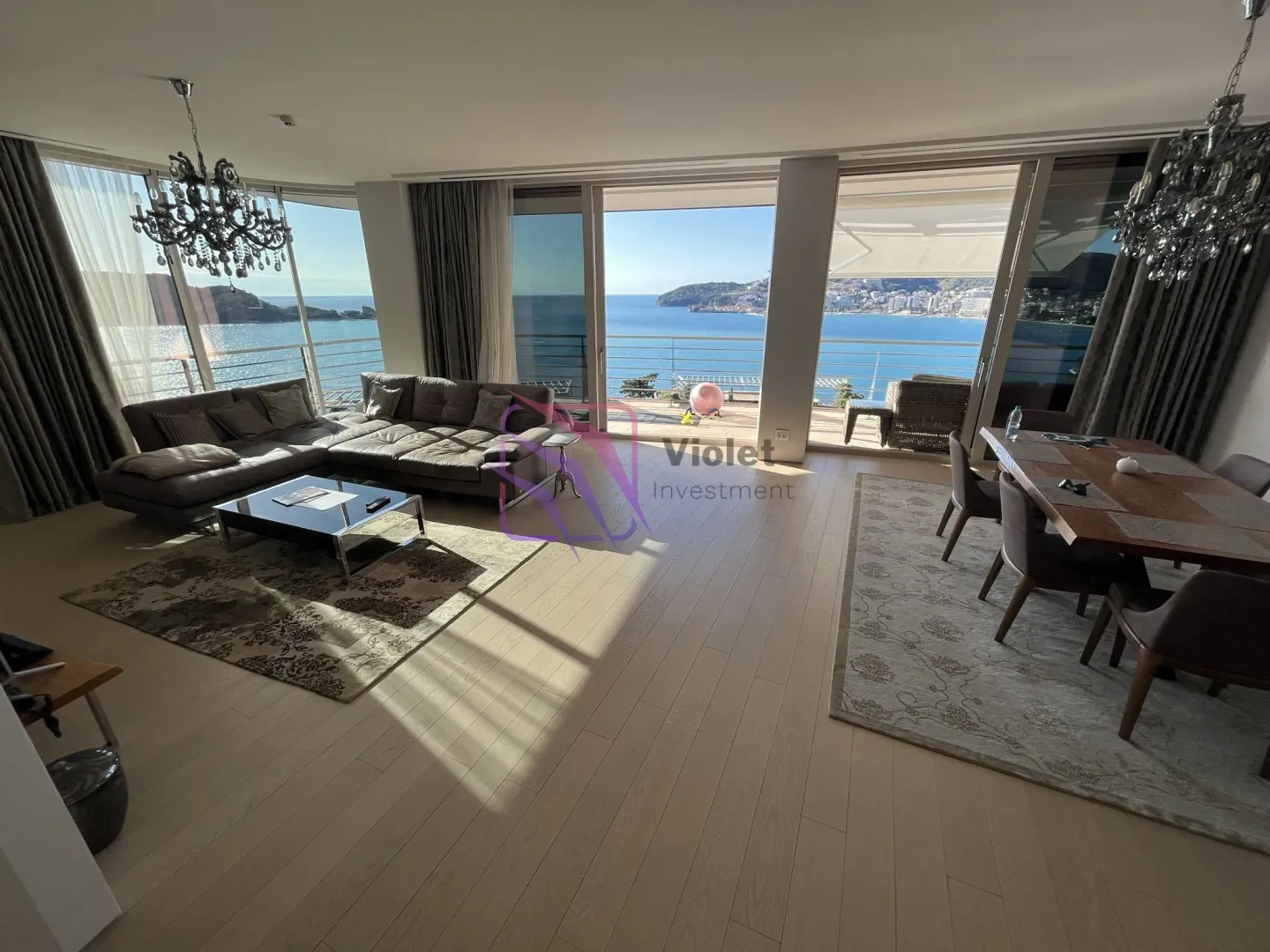 Spacious living room with dining area and sea view.