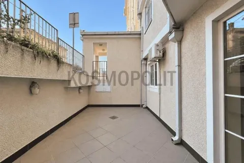 Tiled terrace or courtyard space with a railing and outdoor air conditioning units. - image 7