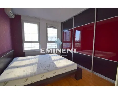 Bedroom with a double bed and a fitted wardrobe. - image 12