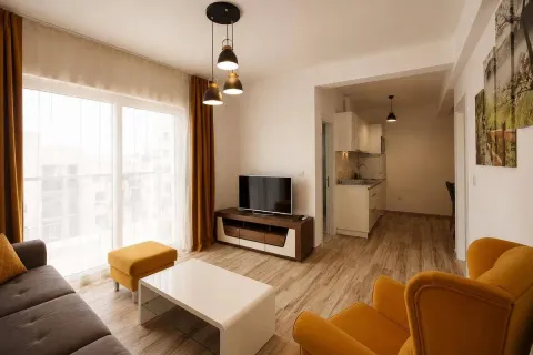 Modern and bright living room with seating area and TV unit. - image 6