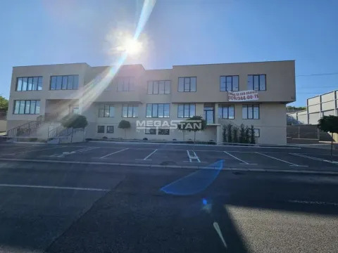 Exterior view of the office building with a parking lot. - image 14