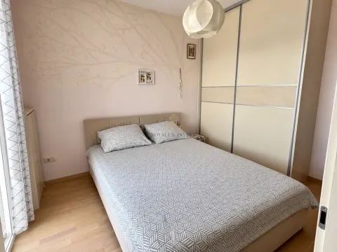 Bedroom with a double bed, large wardrobe, and decorative wall. - image 9