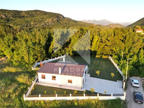 Aerial view of a ground-floor house with a fenced yard and surrounding greenery. - image 23