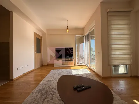 Living room with furniture and terrace access. - image 5