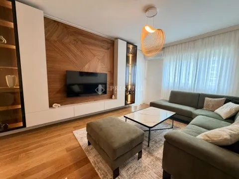 Modern living room with a sofa set and TV unit. - image 2