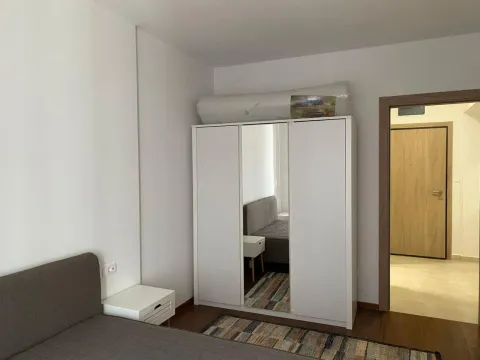 Furnished bedroom with a double bed and wardrobe. - image 7