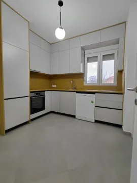 Modern kitchen with built-in cabinetry and white goods. - image 3