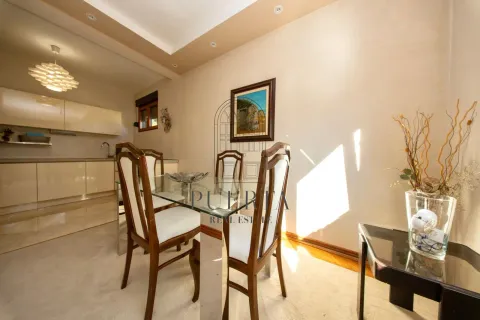 Dining area with a glass table and chairs, connected to the kitchen. - image 15
