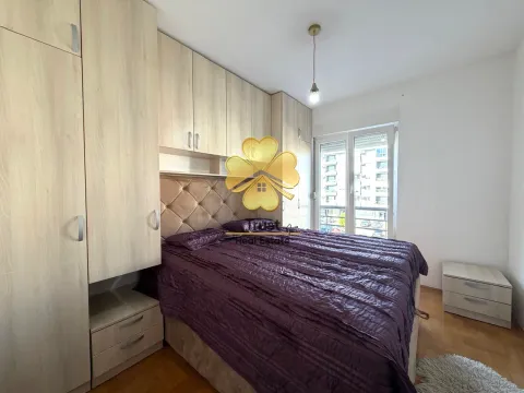 Furnished bedroom with built-in closets and a double bed. - image 13