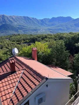 High angle view of a house roof and mountain landscape in the background. - image 3