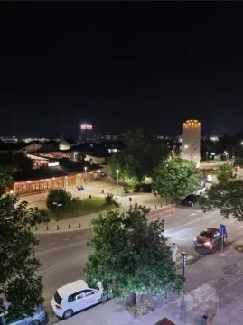 Night view from the terrace overlooking the city square and surrounding streets. - image 6
