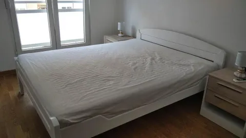 Bedroom with a double bed and nightstands. - image 12